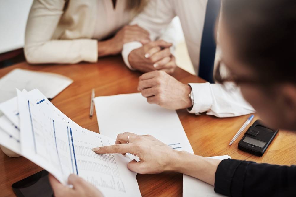 Business, planning and hands for accounting, paperwork and project with discussion and budget